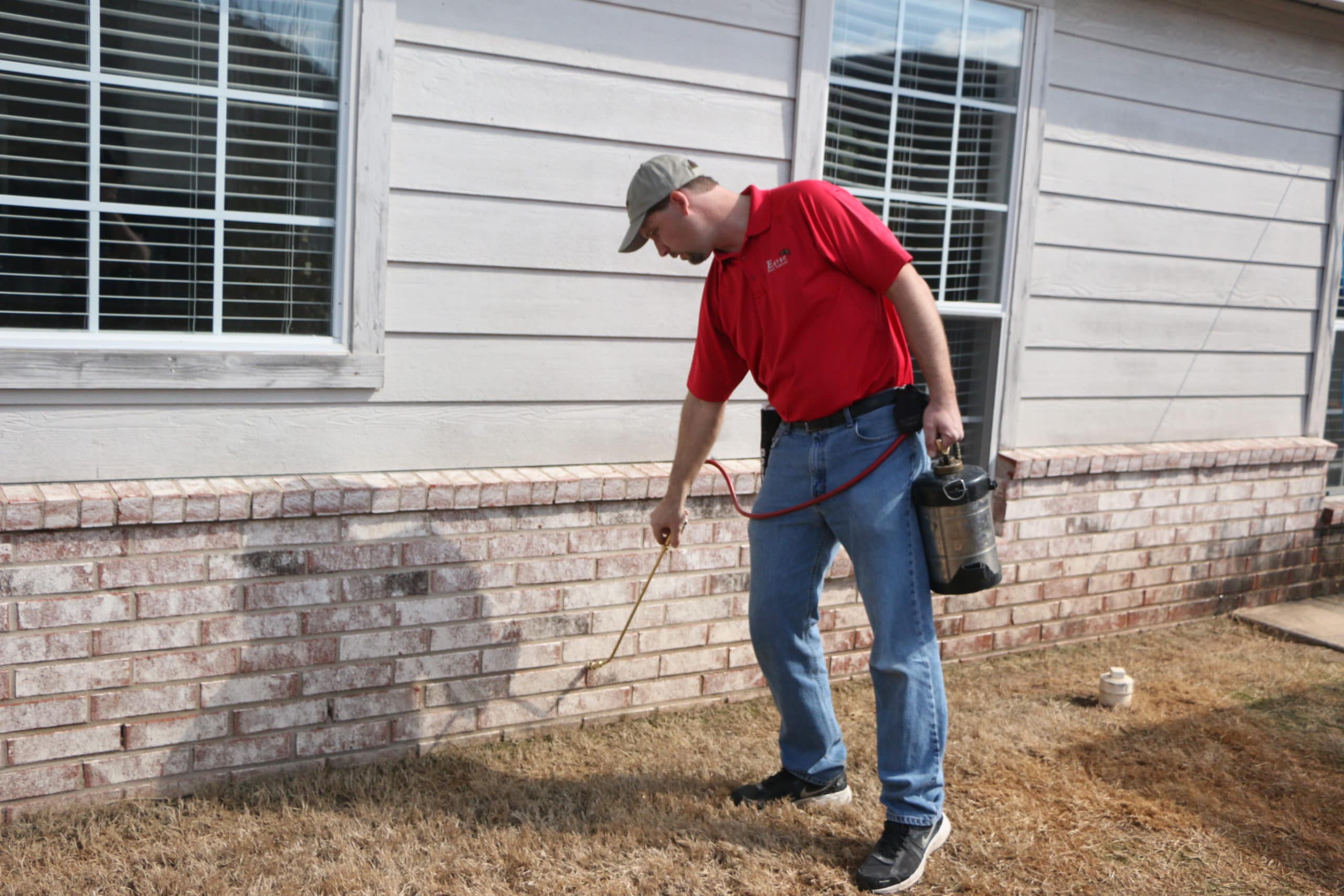 Emtec technician treating the foundation of a home