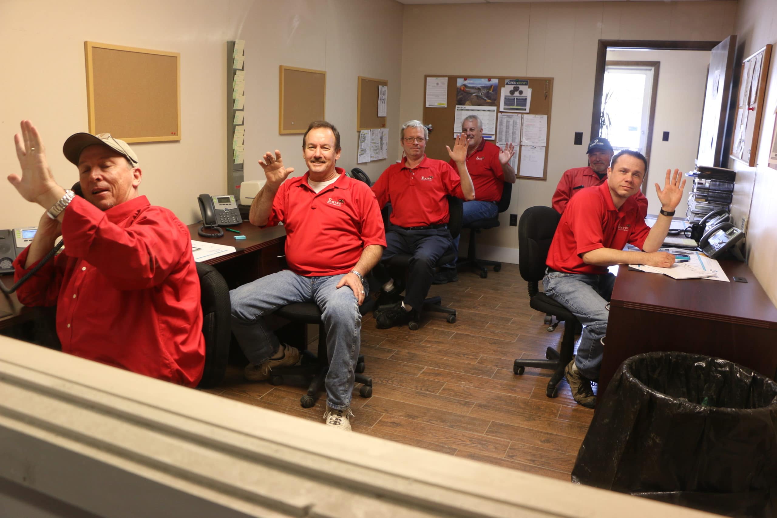 Emtec staff taking calls in the office