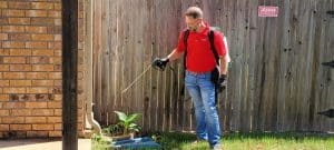 Emtec Pest Control in Tulsa - Exterminator spraying yard