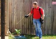 Emtec Pest Control in Tulsa - Exterminator spraying yard