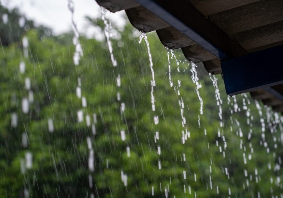 Heavy rain falling on the roof in rainy season